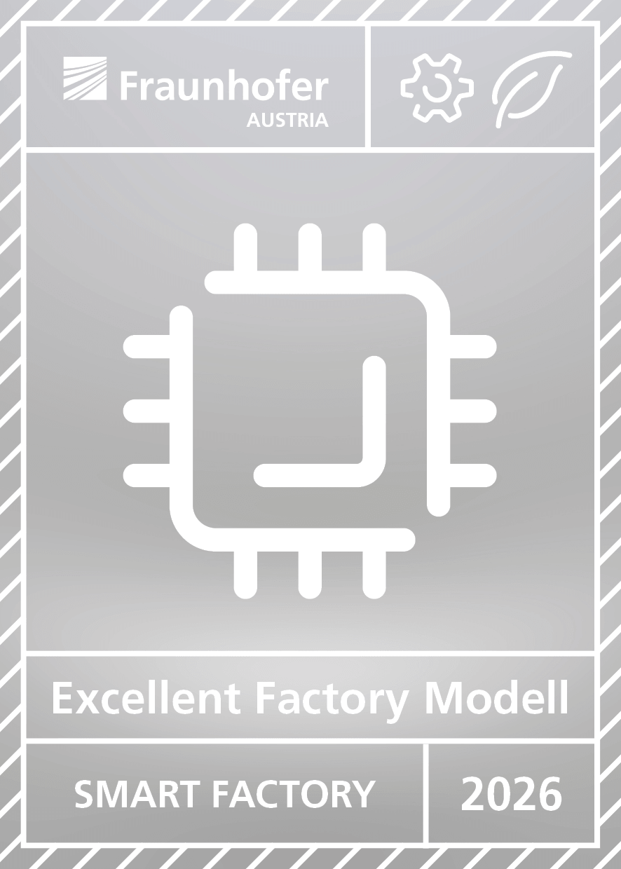 Ein Badge des Fraunhofer Insituts zur Smart Factory of the Year 2026 in Silber